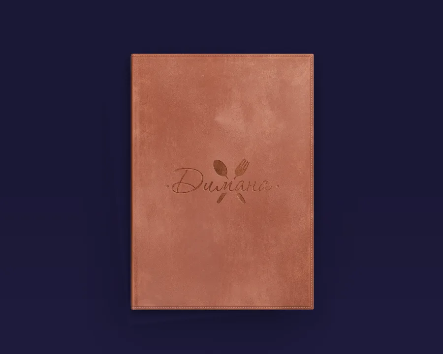 The leather menu cover with the name Dimana, a spoon and a fork