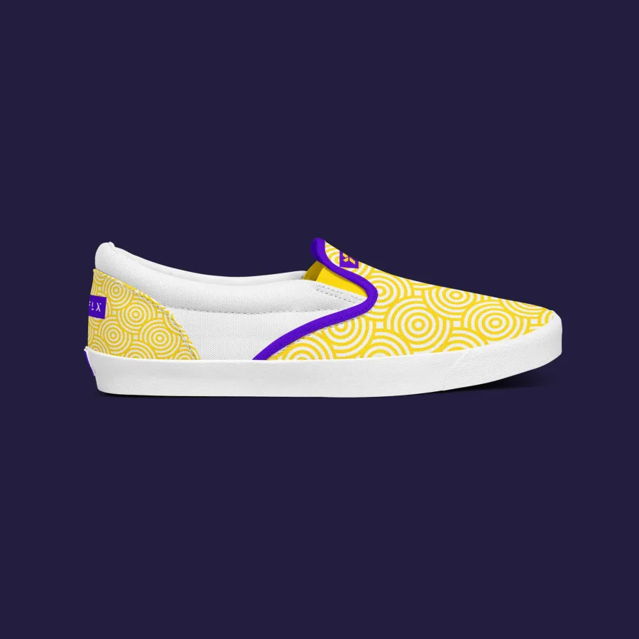 An FLX shoe with the yellow circle pattern and purple piping, side view