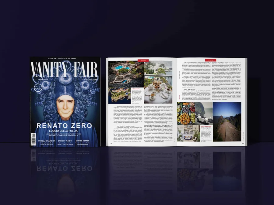 The magazine cover beside a spread with a travel feature, a photo mosaic and text columns