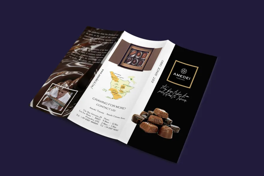 The outside of the brochure: the cover, a map of Tuscany and a box of chocolates