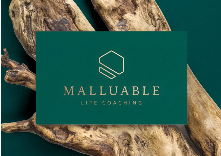 The front of the Malluable card with the gold symbol and wordmark