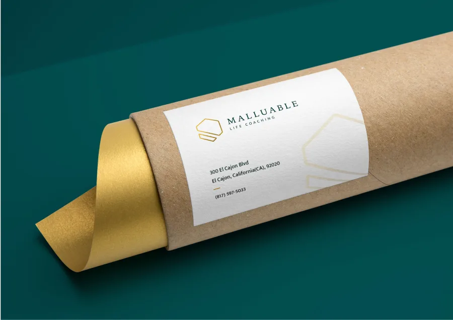 A cardboard tube with the Malluable label and gold paper
