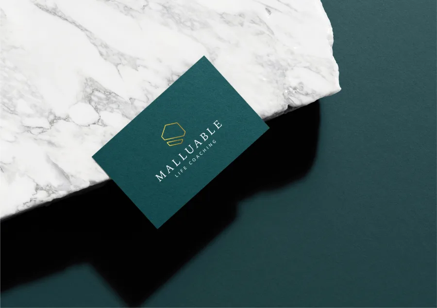 A Malluable business card on marble