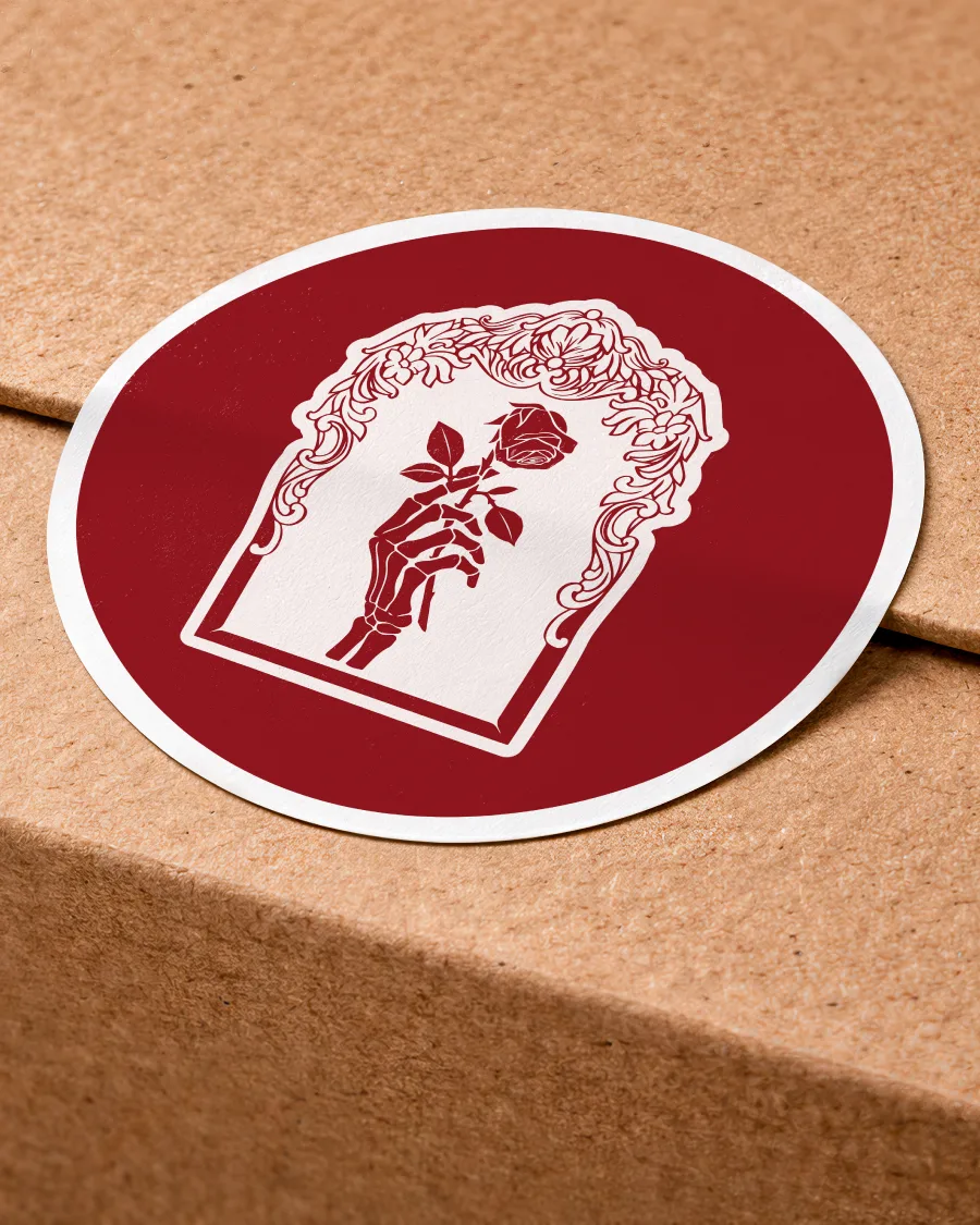 A sticker with The Book emblem
